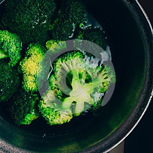 Brocolli boil in the pot. Brocolli changes its color while boiled