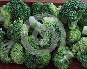 Brocolli florets in a wooden bowl