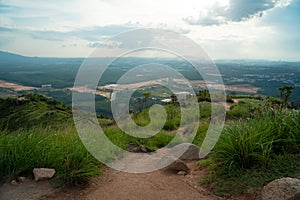 Broga Hill mountain path summer landscape. High hills covered with green grass and rocks. Broga Hill, Malaysia