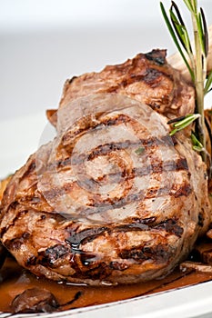 Broiled center cup veal chop closeup photo