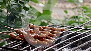 Broiling chicken feet on charcoal