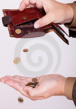 Broke businessman with empty purse and polish coins