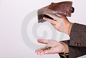 Broke businessman with empty wallet and polish coins