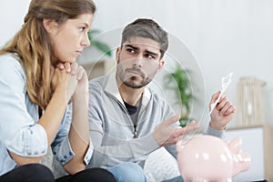 Broke couple with financial problems indoors at new apartment photo