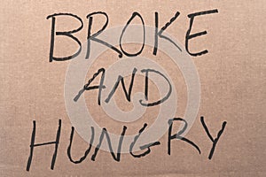 Broke and hungry cardboard sign