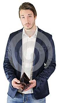 Broke young man showing empty wallet