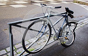 Bicycle with a broken wheel on the street