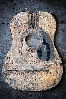 Broken acoustic guitar