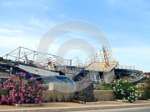 Broken ancient shipwrecks after the disembarkation of refugees