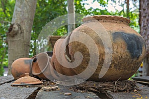 Broken antique clay pot or traditional Jar on abandoned hut