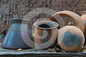 Broken antique clay pot or traditional Jar on abandoned hut