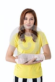 Broken arm Asian woman with arm sling sponsored in her hands sit