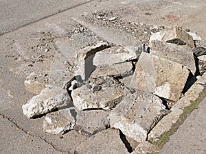 Broken ashphalt on the road restoration photo