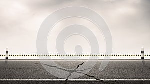 Broken of asphalt highway road with milestones and sky background for design backdrops. Under Construction concept