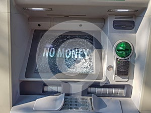 Broken ATM. Cash machine with broken glass