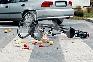 A broken bike on a pedestrian crossing after a collision with a