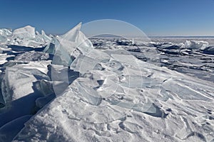 Broken blocks of ice on the frozen lake