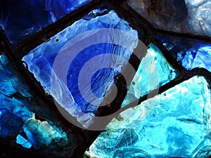 Broken blue stained-glass window.