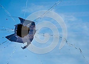 Broken blue window in a high-rise building