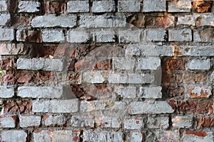 Broken brick wall of an old building.