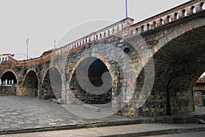 Broken Bridge or Puento Roto, constracted in 1840, destroyed by a flood and partially restored as a tourist site., Cuenca, Azuay photo