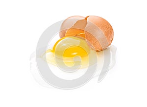 Broken brown chicken egg isolated on white background.