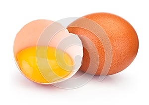 Broken brown egg in eggshell half isolated on white background