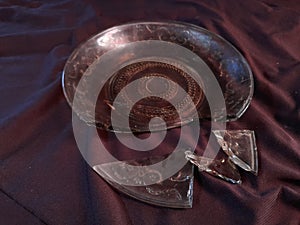 broken brown plate  on a black wooden table