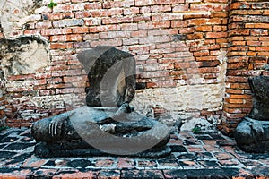 Broken buddha statue, taken outdooor in afternoon