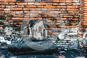 Broken buddha statue, taken outdooor in afternoon