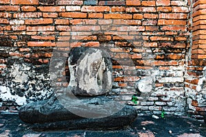 Broken buddha statue, taken outdooor in afternoon photo