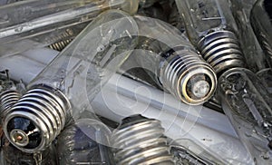 Broken bulbs in a landfill of waste photo