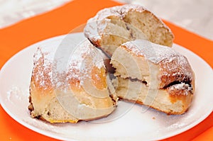 Broken bun on a white plate