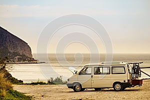 Broken camper van on seaside cliff, Spain