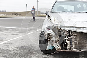 Broken car after the accident in foreground