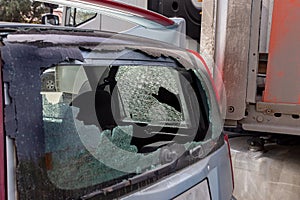 Broken car glass in an accident. Damaged automotive glass background pattern. Broken car as a result of a road accident