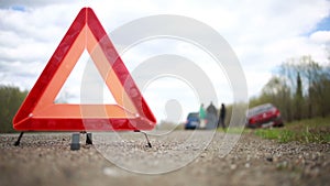 broken car on the roadside. red warning triangle
