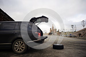 Broken Car with Spare Wheel in Front of Red Square, Moscow, Russia