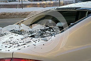 Broken car window. damaged car from falling ice