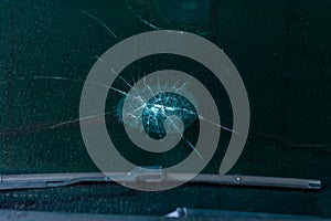 Broken car windshield .Crash windshield glass the broken and damaged car. Tempered glass shattered in an accident. Broken Windshie