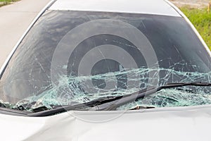 Broken car windshield .Crash windshield glass the broken and damaged car. Tempered glass shattered in an accident. Broken Windshie