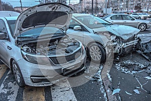 Broken cars after accident. Cityscapes photo