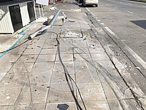 Broken CCTV camera on the footpath by car accident