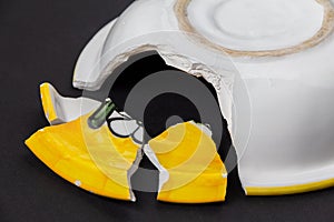 Broken ceramic yellow plate