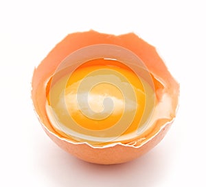 Broken chicken egg and yolk isolated on a white