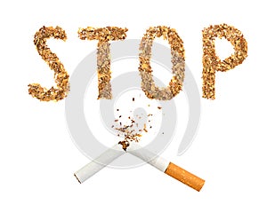 The broken cigaret and word stop made of tobacco photo