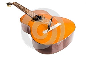Broken classical guitar with detached bridge isolated in white b