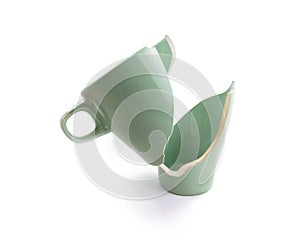 Broken coffee mug on white background, broken cup pieces, Broken relationship and Parting concept.