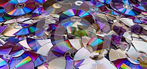 Broken compact discs. Colorful texture detail of obsolete digital media
