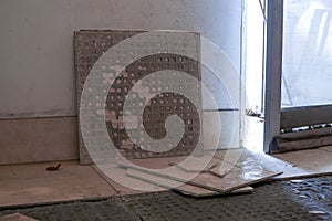 Broken and complete tiles when floor tiles are laid in a house renovation site